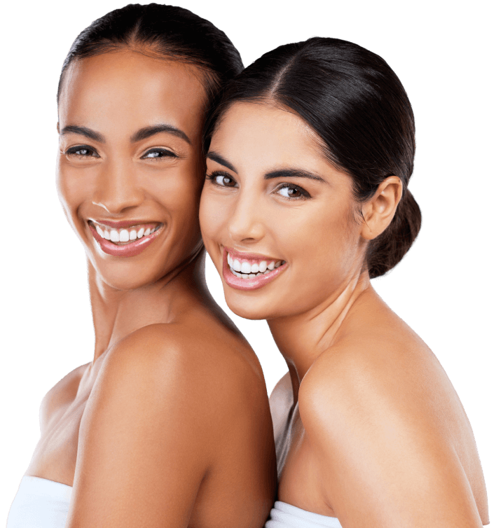 Two beautiful young ladies with perfect skin smiling | Cosmetic Facial | Wellness Marketplace Spa