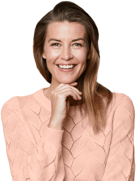 Middle-aged woman smiling with a hand on the chin | Skin Revitalization & Resurfacing | Wellness Marketplace Spa