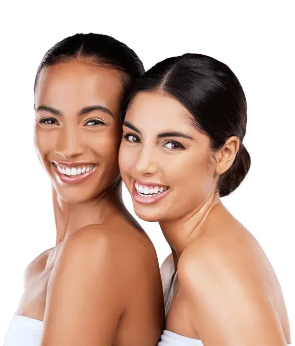 Two beautiful young ladies with perfect skin smiling | Cosmetic Facial | Wellness Marketplace Spa